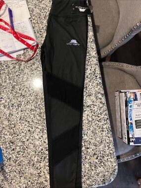 Lotus Leggings Black Leggings with Purple Lotus Logo